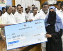K’taka pays compensation to kin of communal violence victims